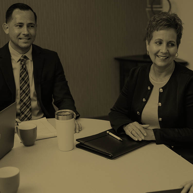 Spencer and Sheri Welsh talking with a client about employment options.