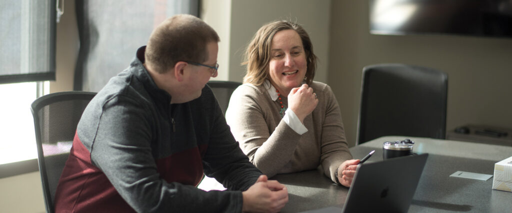 Allison McKenna and Jeremy Conley discussing web design.