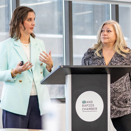 Sarah Morgan and Heather Isch presenting at a Grand Rapids Chamber event.